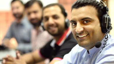 Call centre agents looking at camera and smiling.